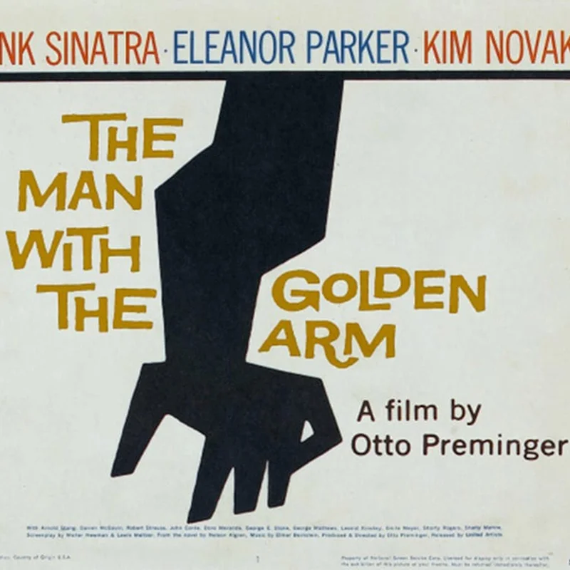 Affiche de film "The Man with the Golden Arm" conçue par Saul Bass, montrant un bras noir stylisé sur fond blanc avec des noms en haut en rouge et bleu.