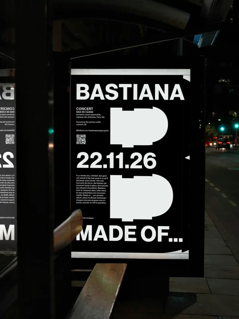 Affiche de concert Bastiana en abribus, grand B blanc sur fond noir, par Giulia, issue d’une formation courte en graphisme